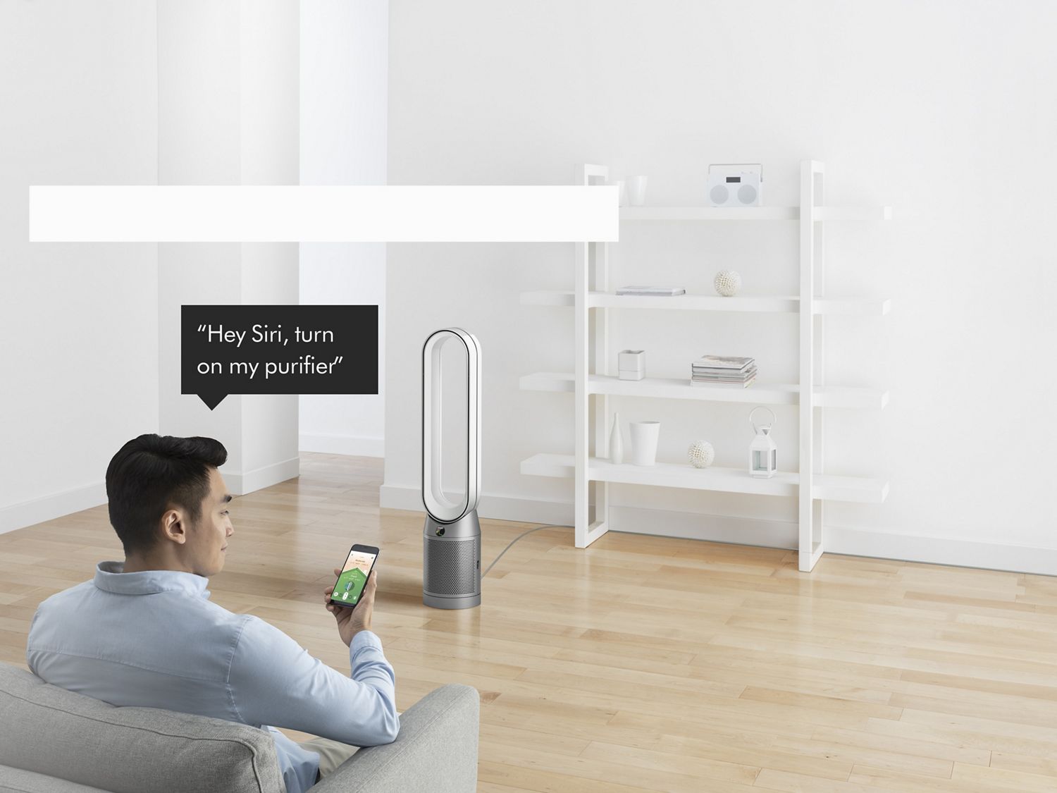 Man with phone controlling his machine with his voice